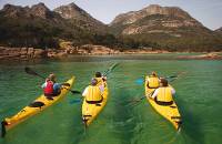 Kayaking the crystal clear waters of the Freycinet Peninsula on Cycle, Kayak and Walk Tasmania