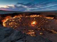 Turkmenistan's Darvaza Gas Crater, also known as the 'Door to Hell', at sunset |  Richard I'Anson